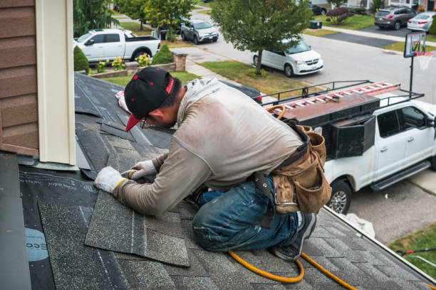 Professional Roofing technician working in West Concord, MA